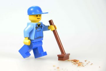 A lego man helping with commercial cleaning services.