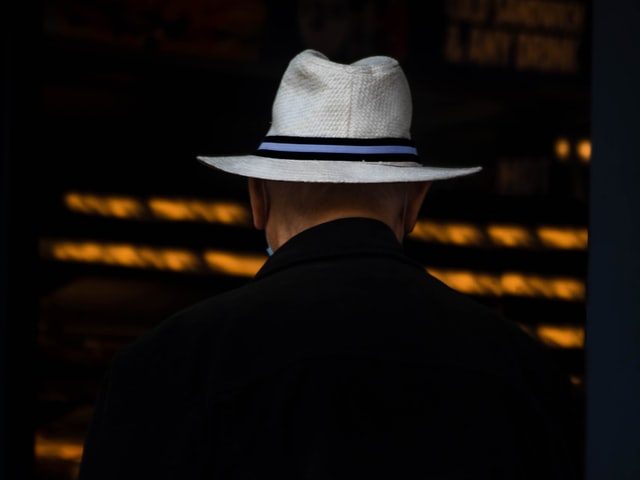 man in white hat
